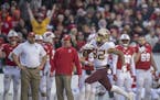 Minnesota's wide receiver Demetrius Douglas ran for a 69 yard punt return for a touchdown during the second quarter as Minnesota took on Wisconsin at 