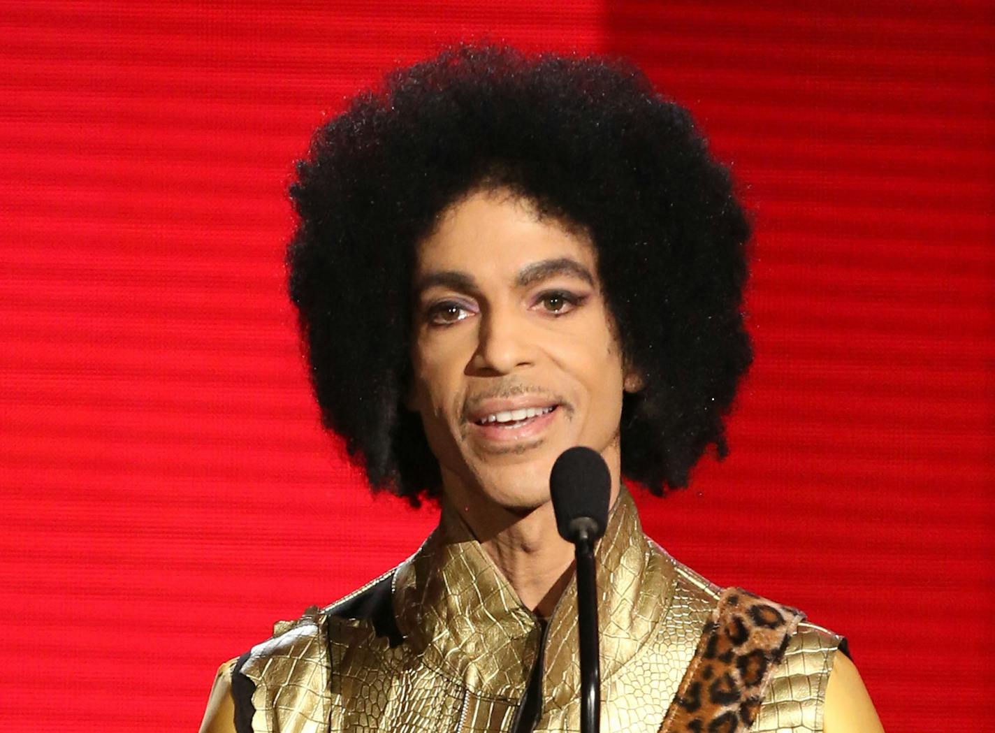 In this Nov. 22, 2015 file photo, Prince presents the award for favorite album - soul/R&B at the American Music Awards in Los Angeles.