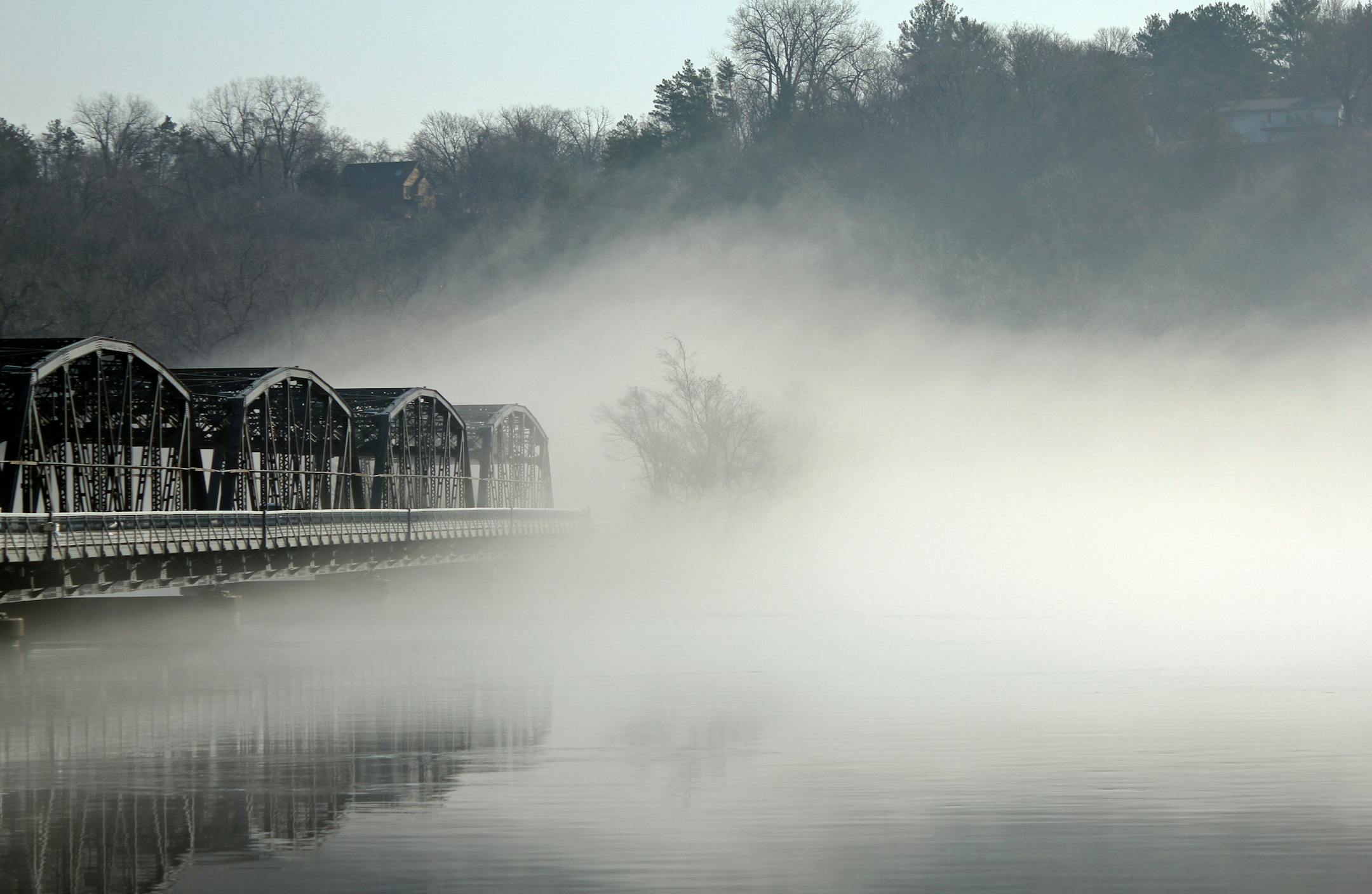 In "Erasing Wisconsin," fog obscures the Wisconsin end of the Stillwater Lift Bridge. The photo won first place in the Youth Landscape division.