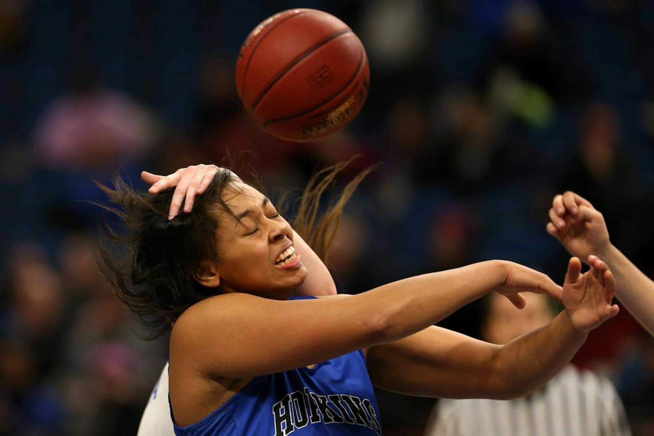 Hopkins' Dlayla Chakolis (33) took a hand to the head as she went up for a rebound in the second half.