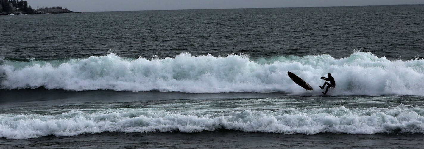 A surfer is knocked from his board by a wave on Lake Superior near Stony Point Thursday, March 17, 2016, in Two Harbors MN.](DAVID JOLES/STARTRIBUNE)djoles@startribune.com A few years back, there were just a few men who dared surf Lake Superior. But this winter, after a winter storm, dozens of enthusiasts go out from Stony Point onto the massive lake. Surfers say the increased interest is partly due to improved wetsuit technology, partly due to social media. But the best waves come in winter, af