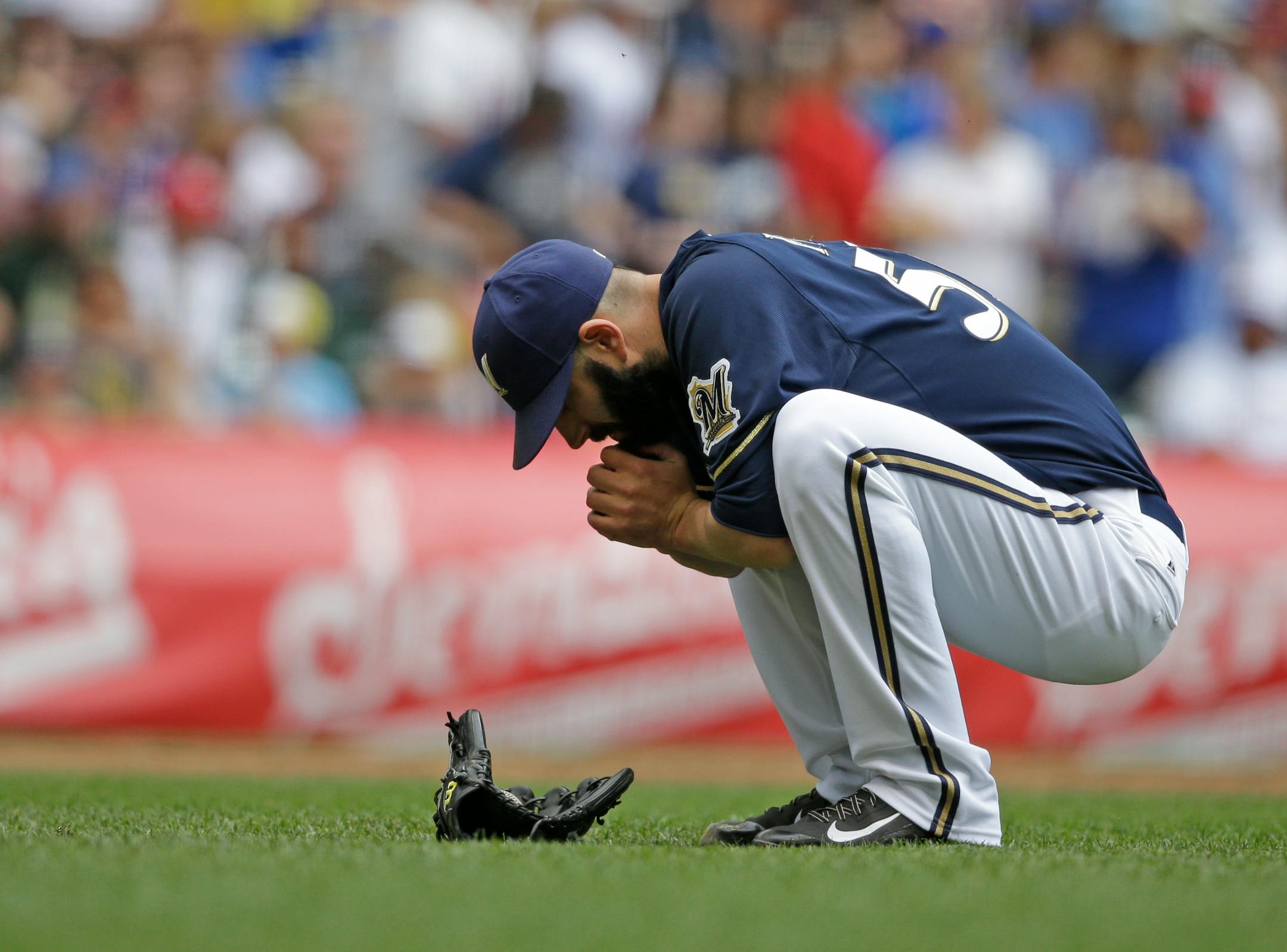Milwaukee Brewers starting pitcher Mike Fiers waits as a play is reviewed during the third inning of a baseball game against the Minnesota Twins, Sunday, June 28, 2015, in Milwaukee. (AP Photo/Jeffrey Phelps)