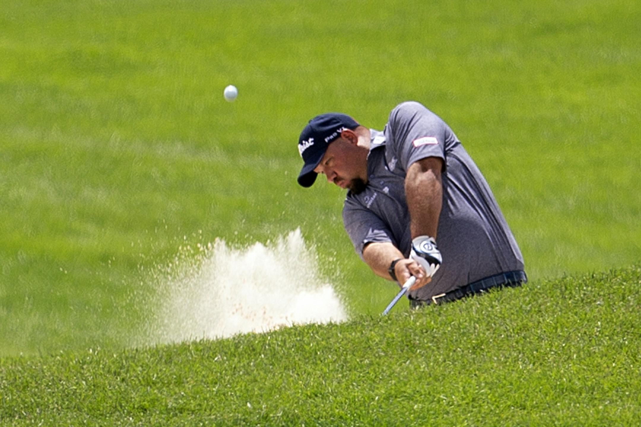 Brendon de Jonge hits from a bunker during the first round of the 3M Open golf tournament in Blaine, Minn., Thursday, July 23, 2020.