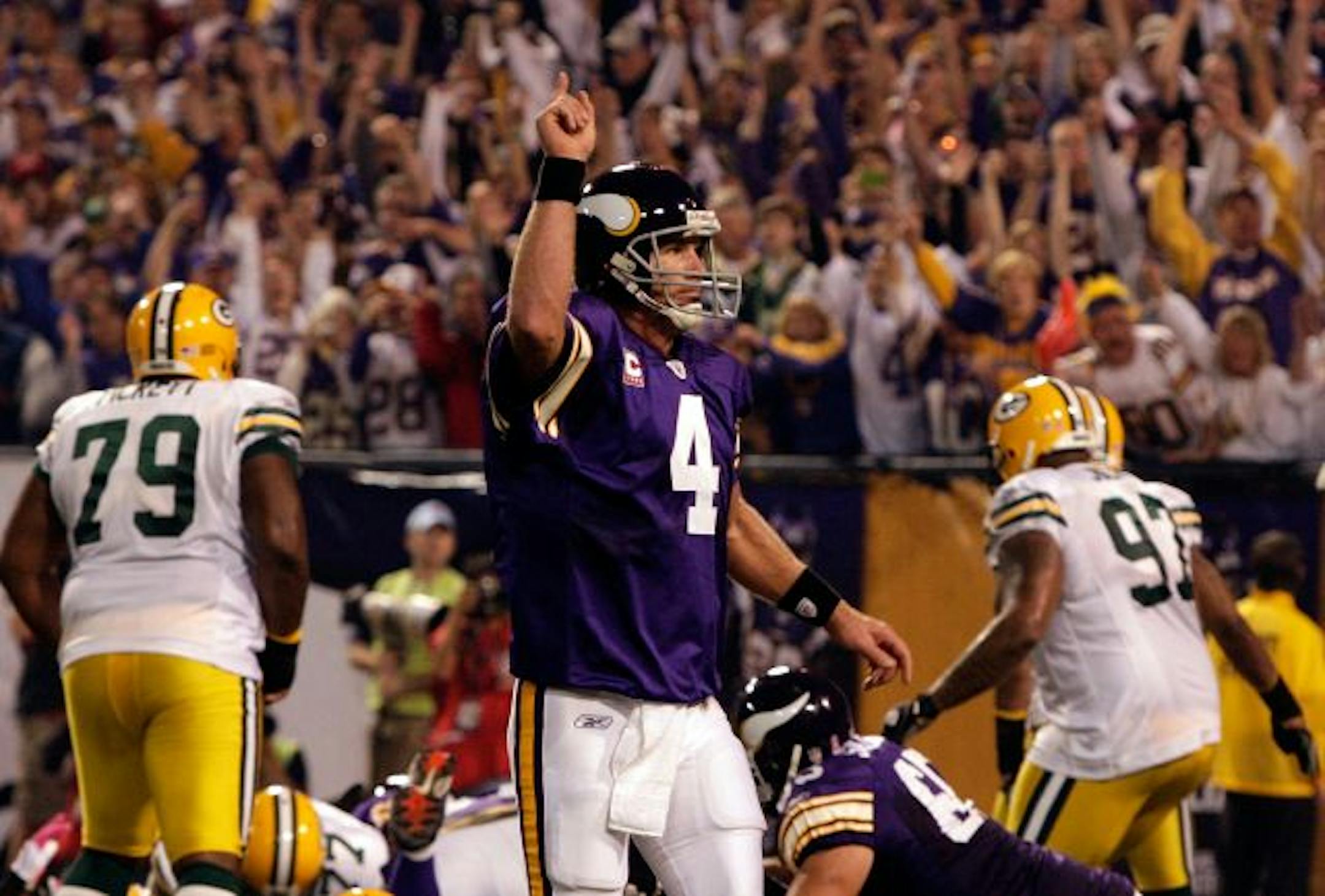 MINNEAPOLIS - OCTOBER 05: Quarterback Brett Favre #4 of the Minnesota Vikings celebrates after a touchdown during the game against the Green Bay Packers on October 5, 2009 at Hubert H. Humphrey Metrodome in Minneapolis, Minnesota.
