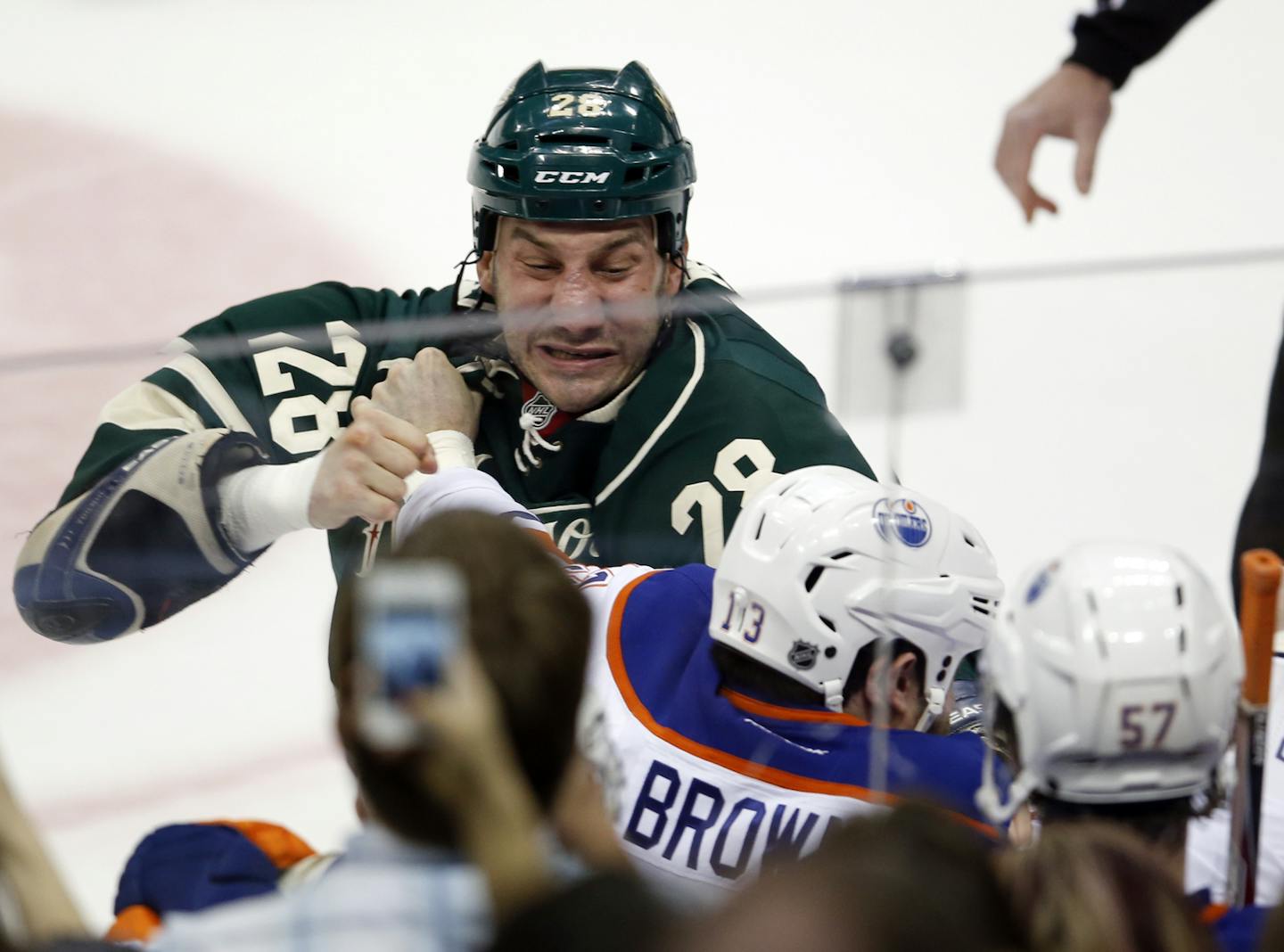 The game began with a fight in the opening seconds between the Edmonton Oilers Mike Brown (13) and the Minnesota Wild's Zenon Konopka (28) during first period action Friday, April 26, 2013, at the Xcel Energy Center in St. Paul.