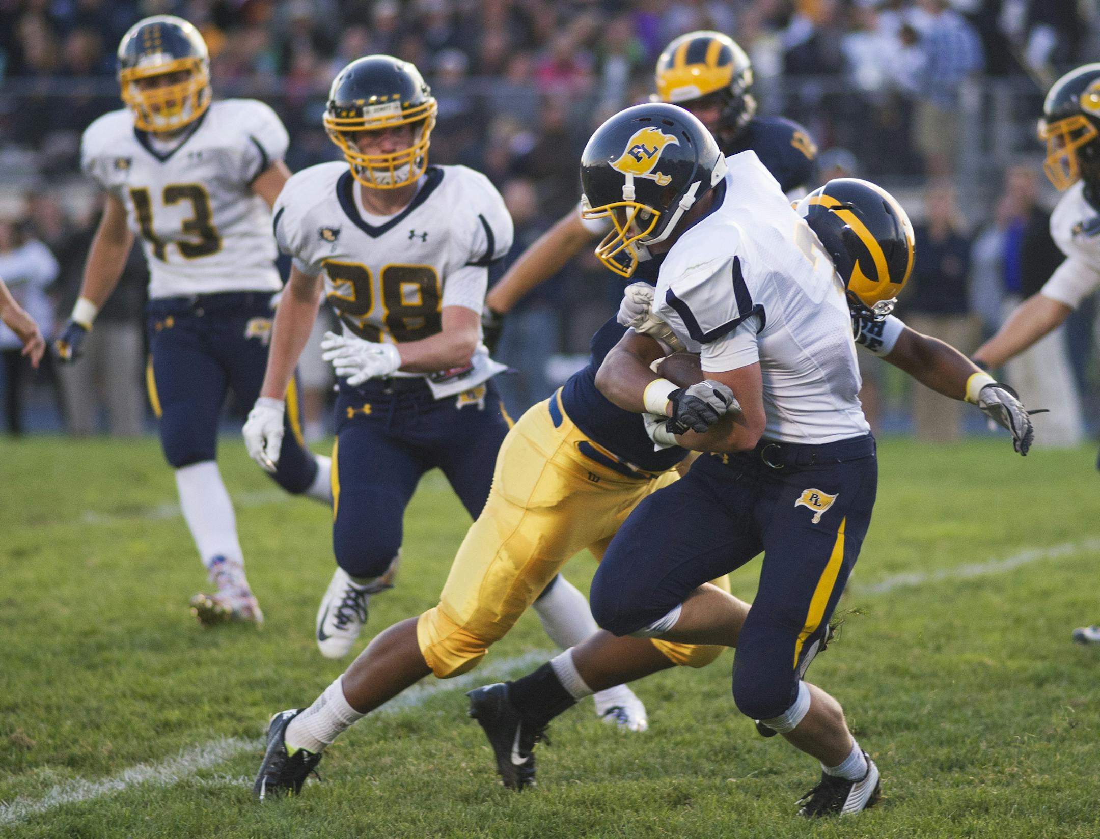 Rosemount's Gabe Ames wraps up Prior Lake's Logan Petersmeyer. ] (Matthew Hintz, 090514, Rosemount)