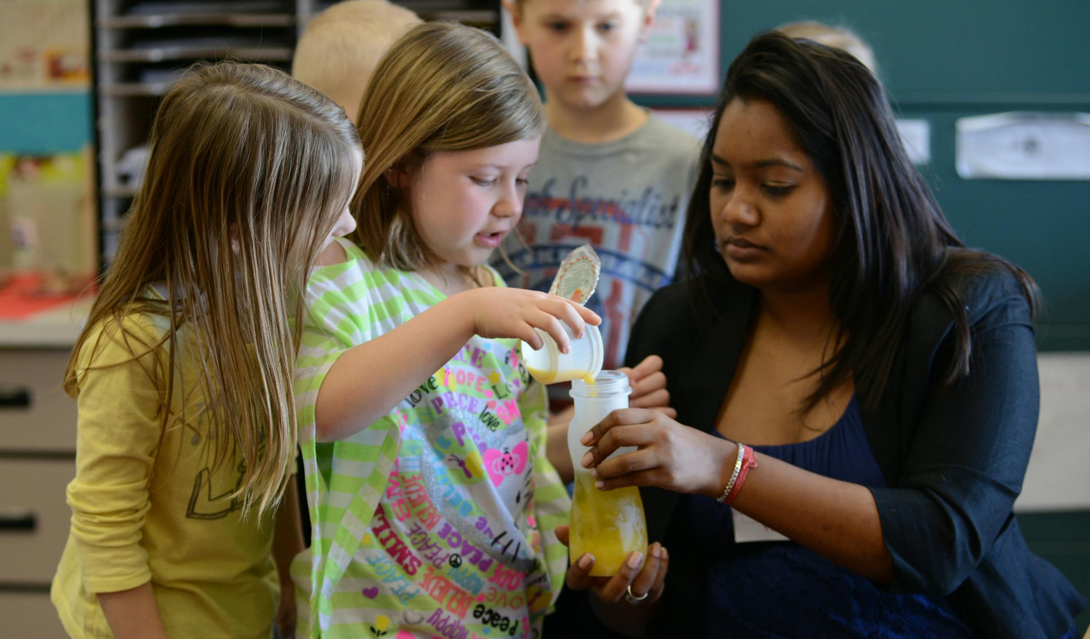 At the Red Pine Elementary School the goal of the Food Explorers program is to get kids eating more fruits and vegetables. To do this, they go into schools and teach kids about nutrition, including how to prepare recipes that are healthy and taste good. First graders made superhero salads that featured spinach,apples and cheese . Aruna Budhram, a U of M masters student in health nutrition student who volunteers with the Food Explorer program helped first grader Bailey Childs make a salad dressin
