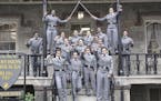 This undated image taken from Twitter shows 16 black, female cadets in uniform with their fists raised while posing for a photograph at the United Sta