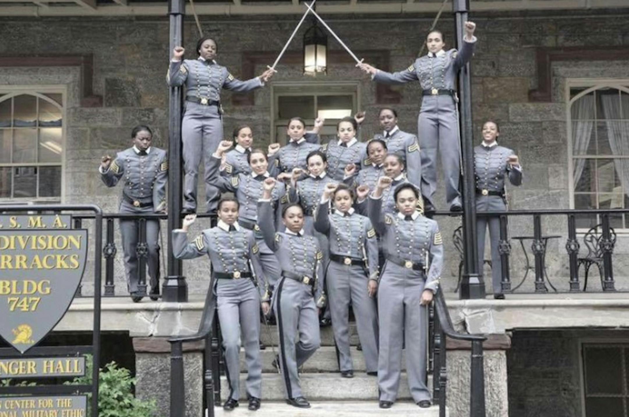 This undated image taken from Twitter shows 16 black, female cadets in uniform with their fists raised while posing for a photograph at the United States Military Academy at West Point, N.Y. Self-expression is hardly a part of life for cadets at the United States Military Academy at West Point. So it was very out of the ordinary when 16 black women put their own spin on the traditional graduation photo, and hoisted their fists in the air while posing in their dress uniforms, swords at their side