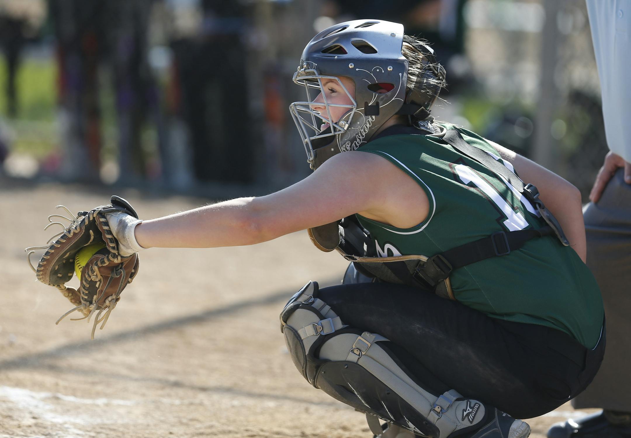 At Bielenberg Sports Complex in Woodbury, New Life Academy catcher Malorie Giere(10) caught against Holy Family in a game. (Richard Tsong-Taatarii)