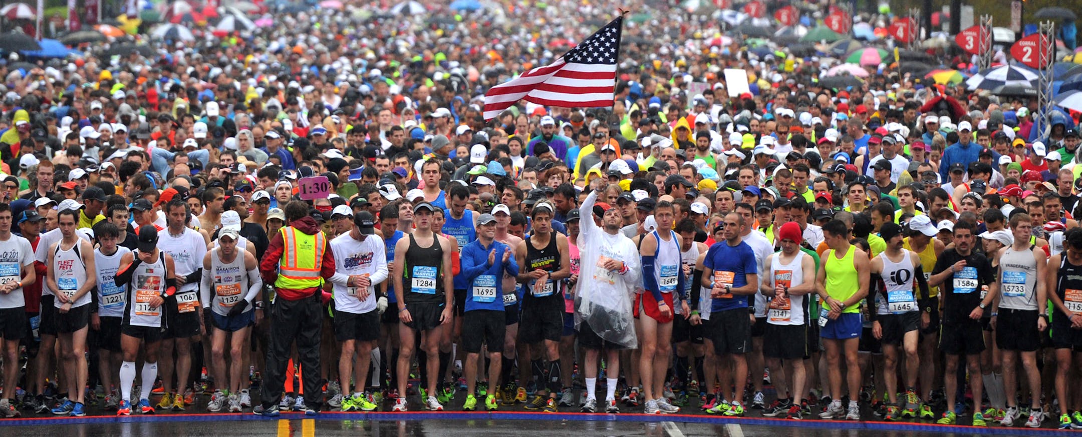 Runners take a moment of silence for those injured and killed in the Boston Marathon bombings before the start of the Country Music Marathon, Saturday, April 27, 2013 in Nashville, Tenn. (AP Photo/The Tennessean, Shelley Mays) NO SALES