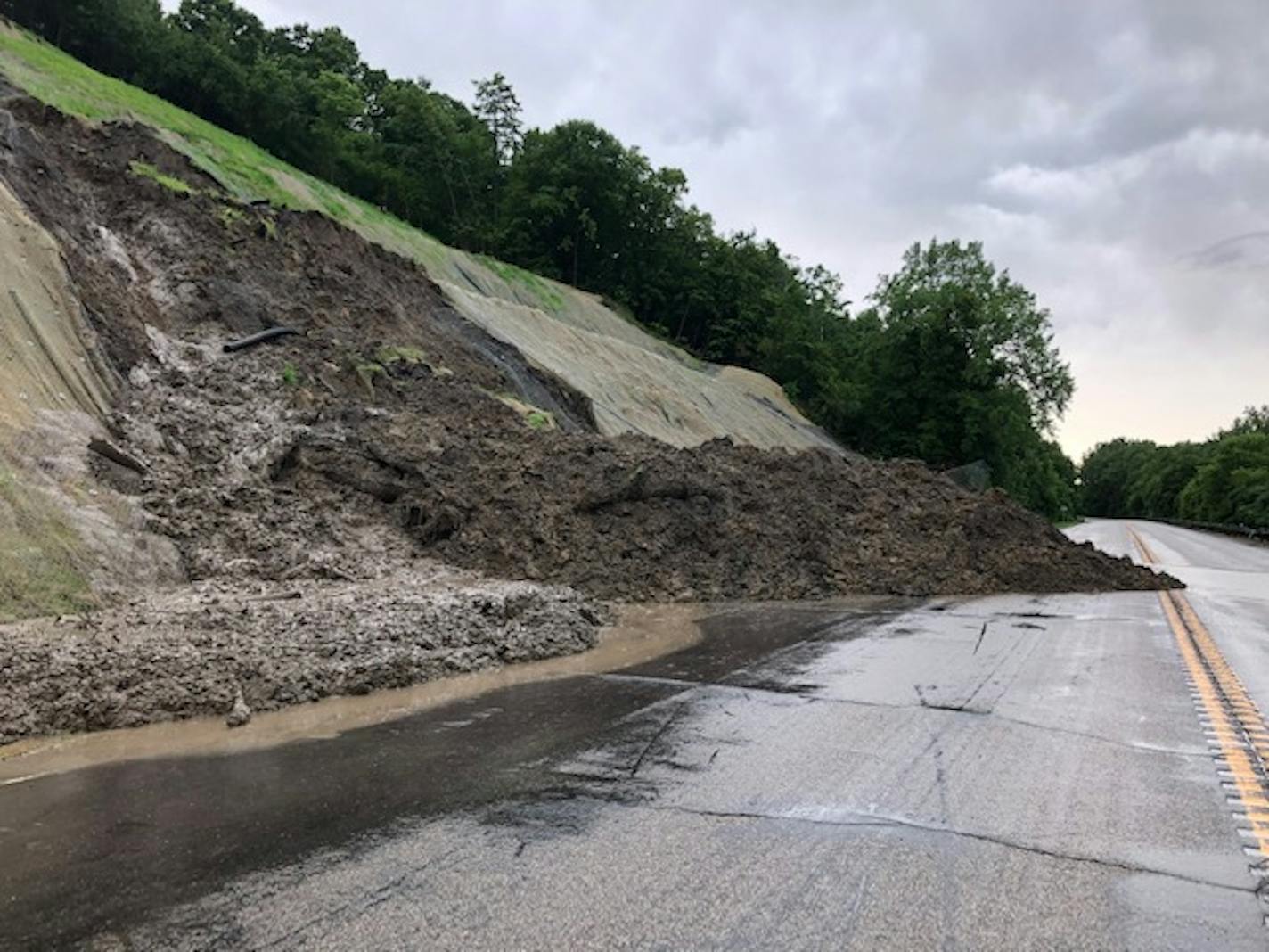 Mud covered Hwy. 68 near Courtland, Minn., just east of New Ulm on Monday morning.