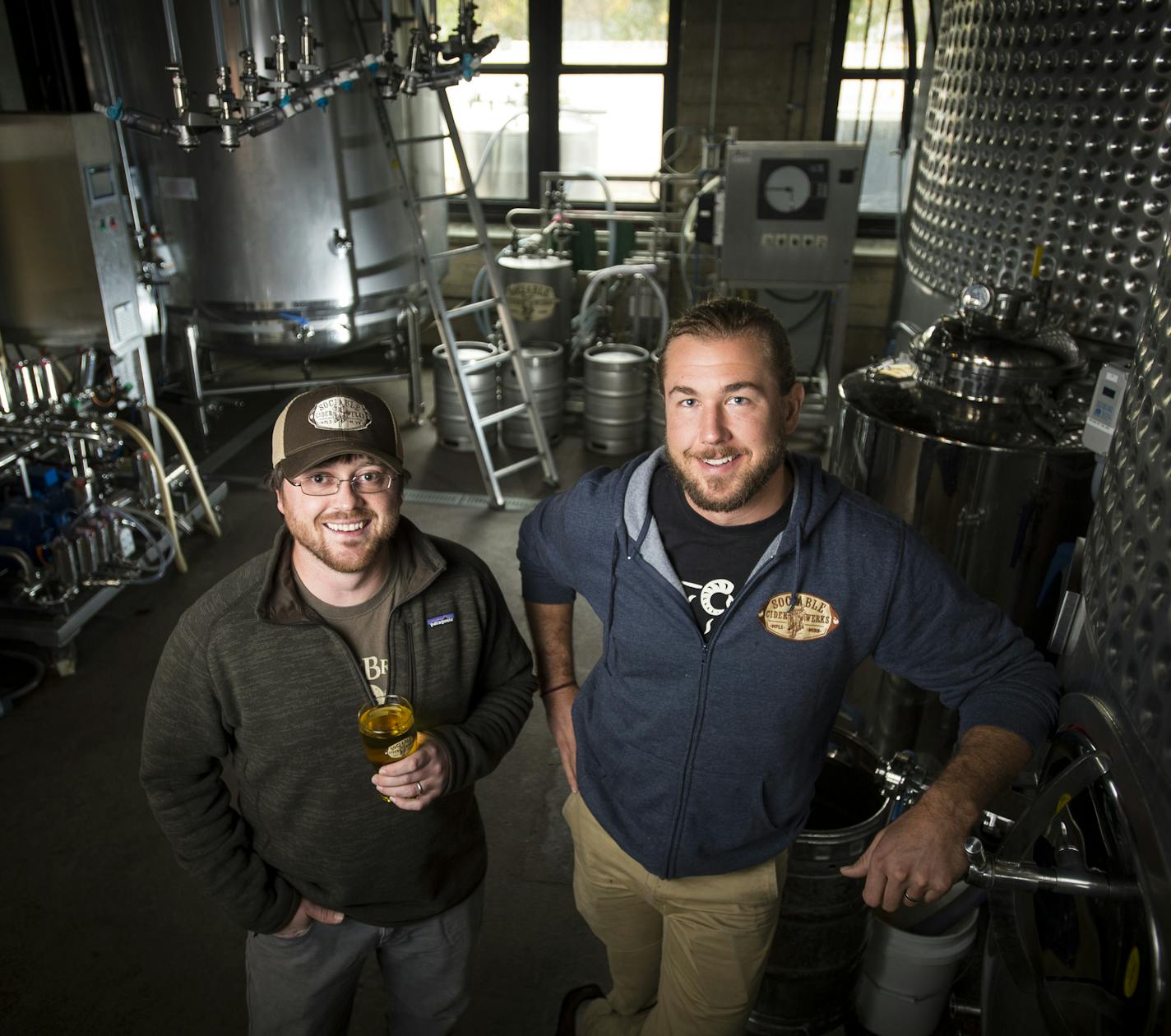 Wade Thompson, left, and Jim Watkins were photographed next to the fermenters at Sociable Cider Werks in Minneapolis.