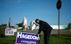 Rep. Jim Hagedorn knocked on doors and talked with folks in Le Sueur, Minnesota during a campaign swing. He put a sign up at the home of a supporter. 