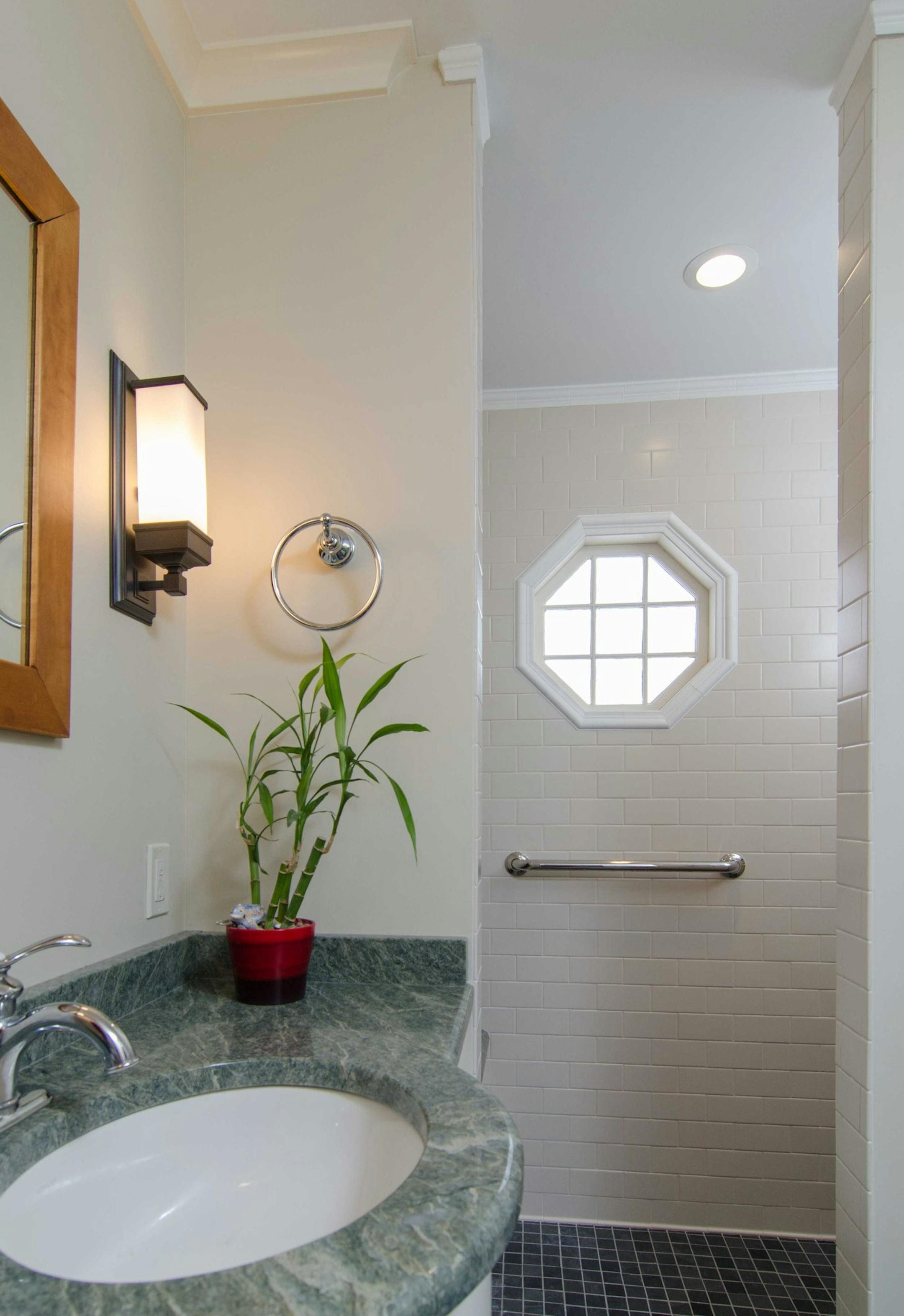 Carlsen & Frank Architects turned a tiny powder room into an accessible bathroom for a homeowner with limited mobility.