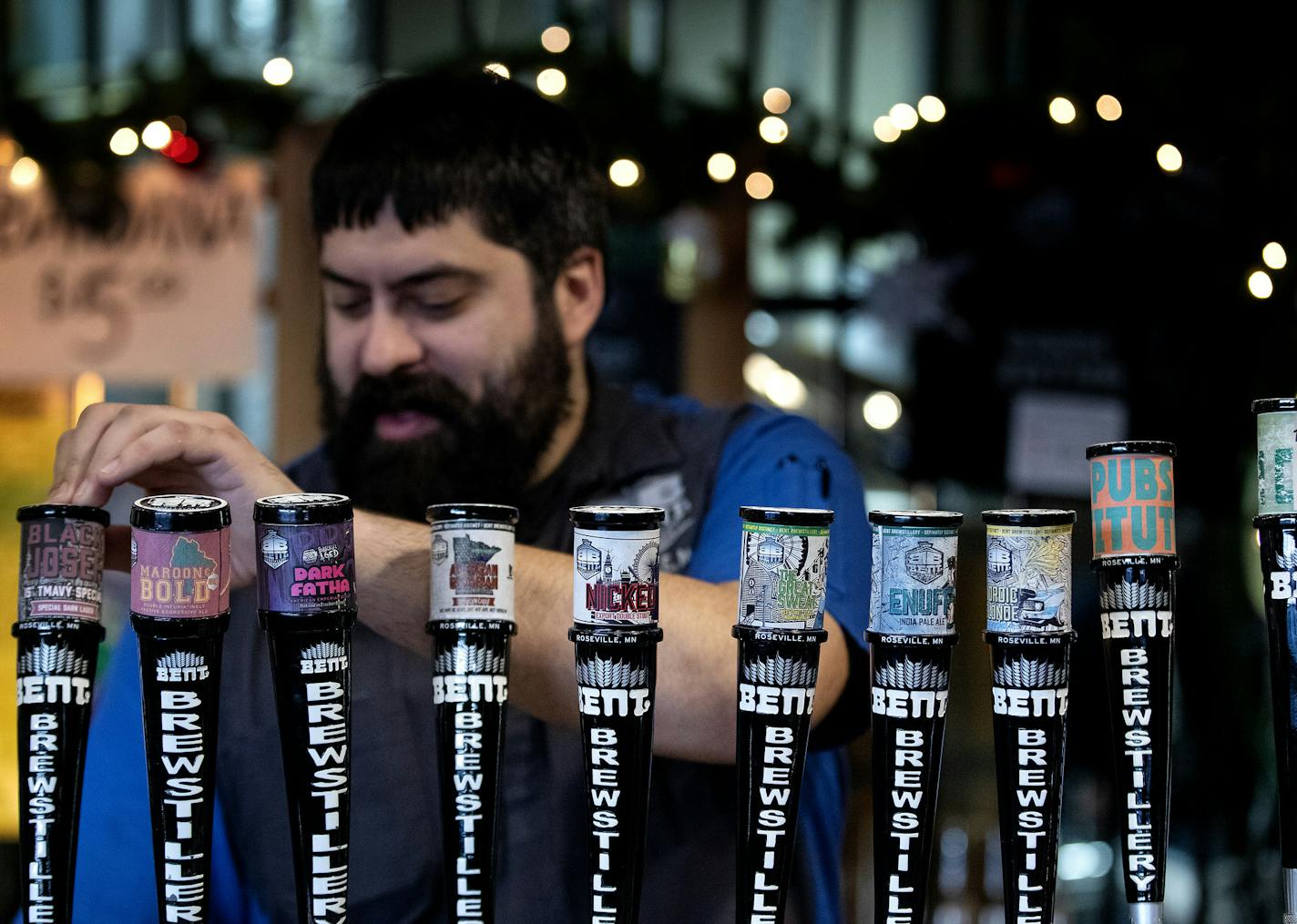 Colin Miller, a manager at Bent Brewstillery poured a beer. Both the owner of the business and the city of Roseville are aiming to change a state law.