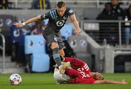 In his previous stint with Minnesota United, Ján Greguš, top, had a collision with FC Dallas midfielder Andrés Ricaurte at Allianz Field.