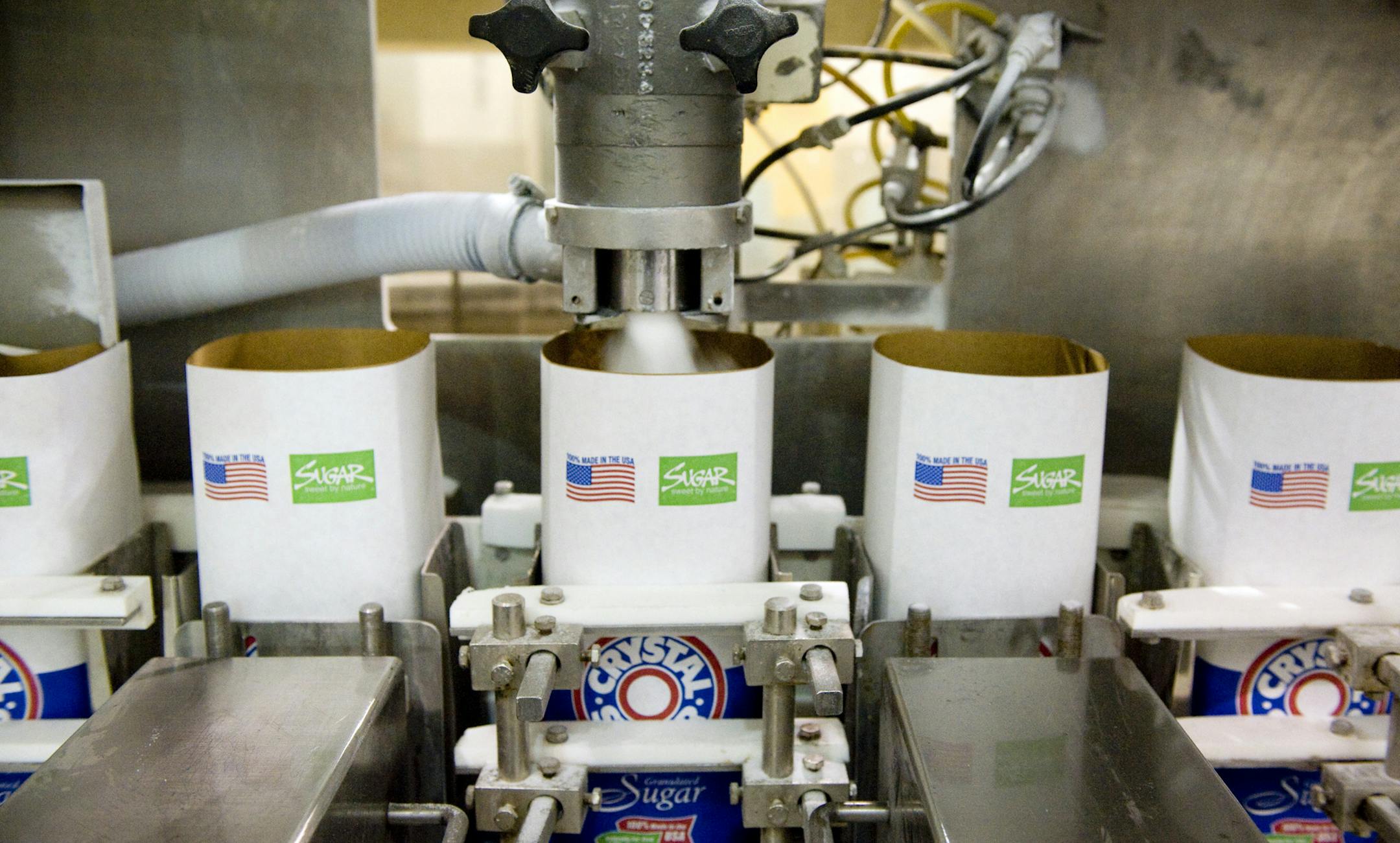 GLEN STUBBE • gstubbe@startribune.com -- Monday, October 11, 2011 -- Moorhead, MN -- ] Five-pound bags of table sugar from beets are filled at American Crystal Sugar Company in Moorhead. ORG XMIT: MIN2013061817122036