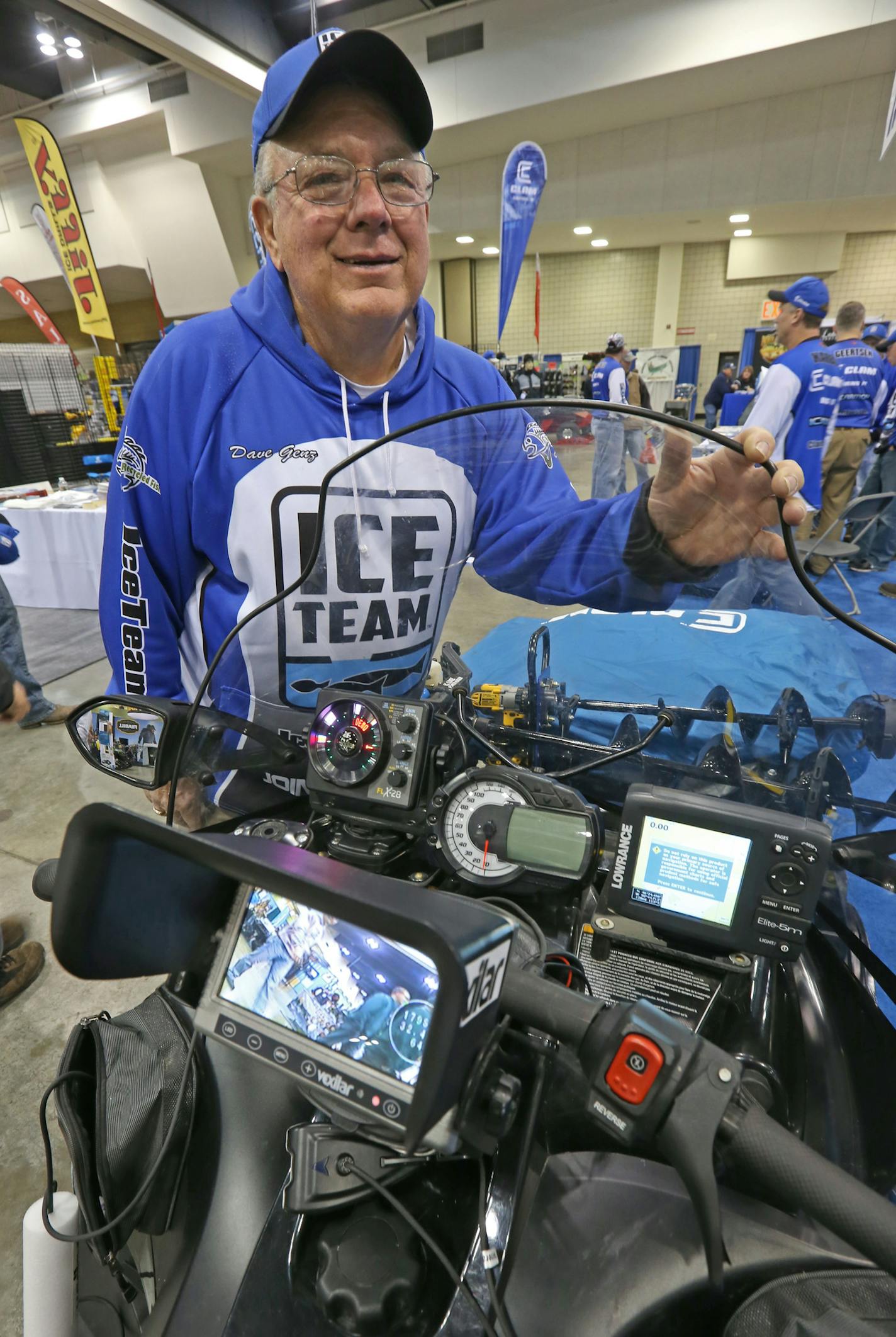 Dave Genz stood next to his snowmobile equipped with ice augers, underwater cameras, fish finders and Clam ice fishing shelters. Genz was at the St. Paul Ice Fishing Show on 12/6/13.] Bruce Bisping/Star Tribune bbisping@startribune.com Dave Genz/source.