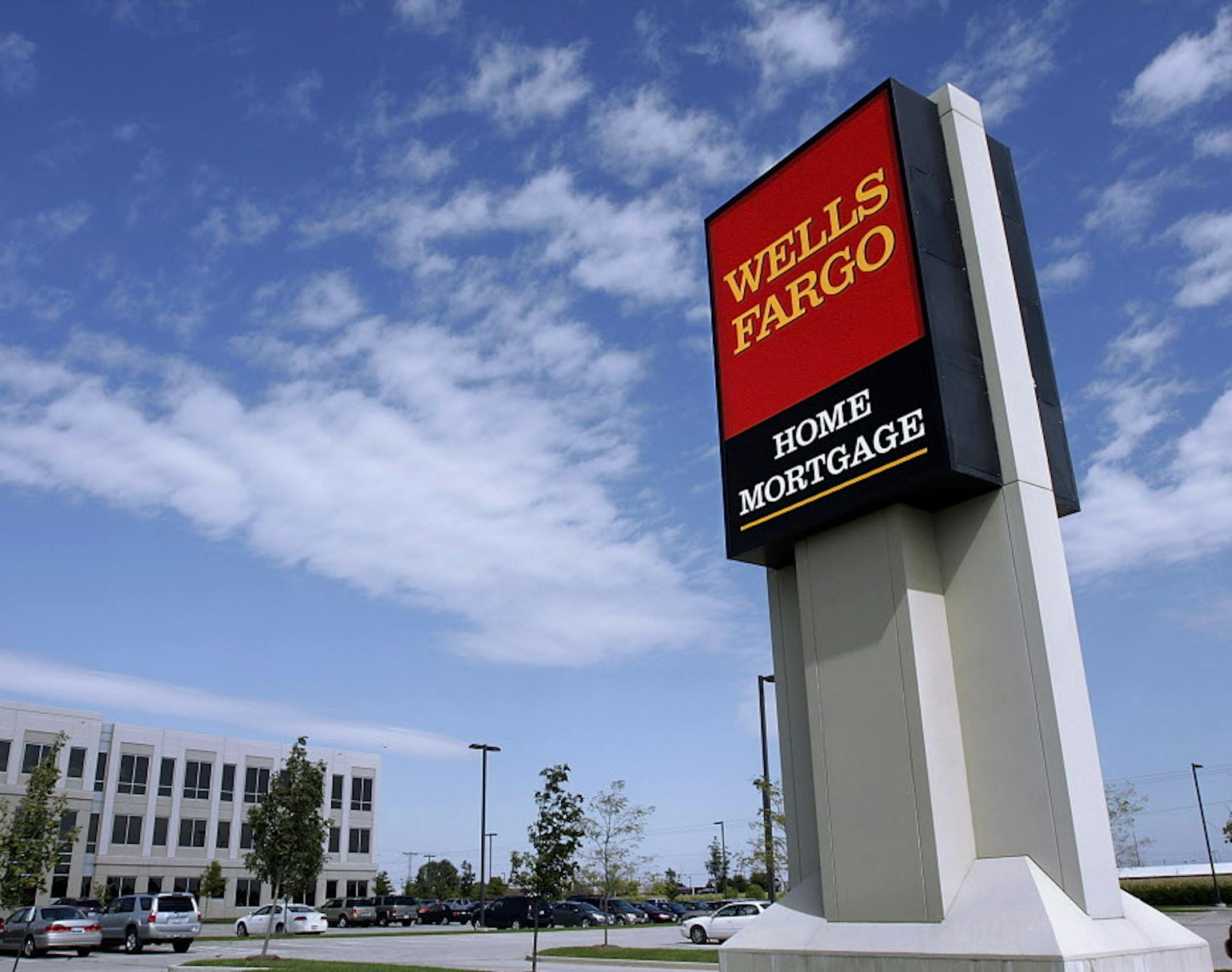 The Wells Fargo logo is displayed outside a home mortgage office in Springfield, Ill., Friday, Oct 3, 2008. A battle broke out for control of Wachovia Friday as Wells Fargo signed a $15.1 billion agreement to buy the Charlotte, N.C.-based bank. )