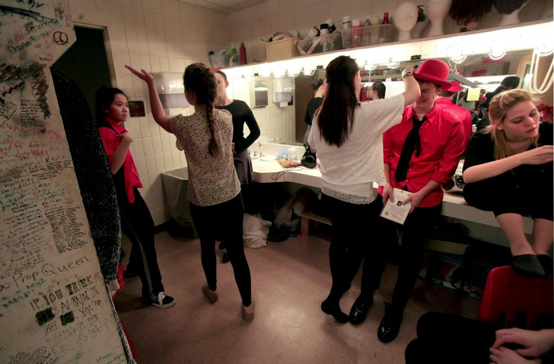 Actors get dressed for their rehersal at Visitation High School who are putting on a play at school in conjunction with Interact Center for the Arts, a theater company that helps disabled people perform. Mendota Heights, MN on January 30, 2013.
