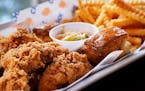 A CHX meal featured hand-breaded chicken, biscuits, fries, cajun honey slaw and their signature sauce.