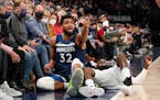 Karl-Anthony Towns (32) looks to the referee to call a foul after colliding with Dallas Mavericks guard Tim Hardaway Jr. during the second half.