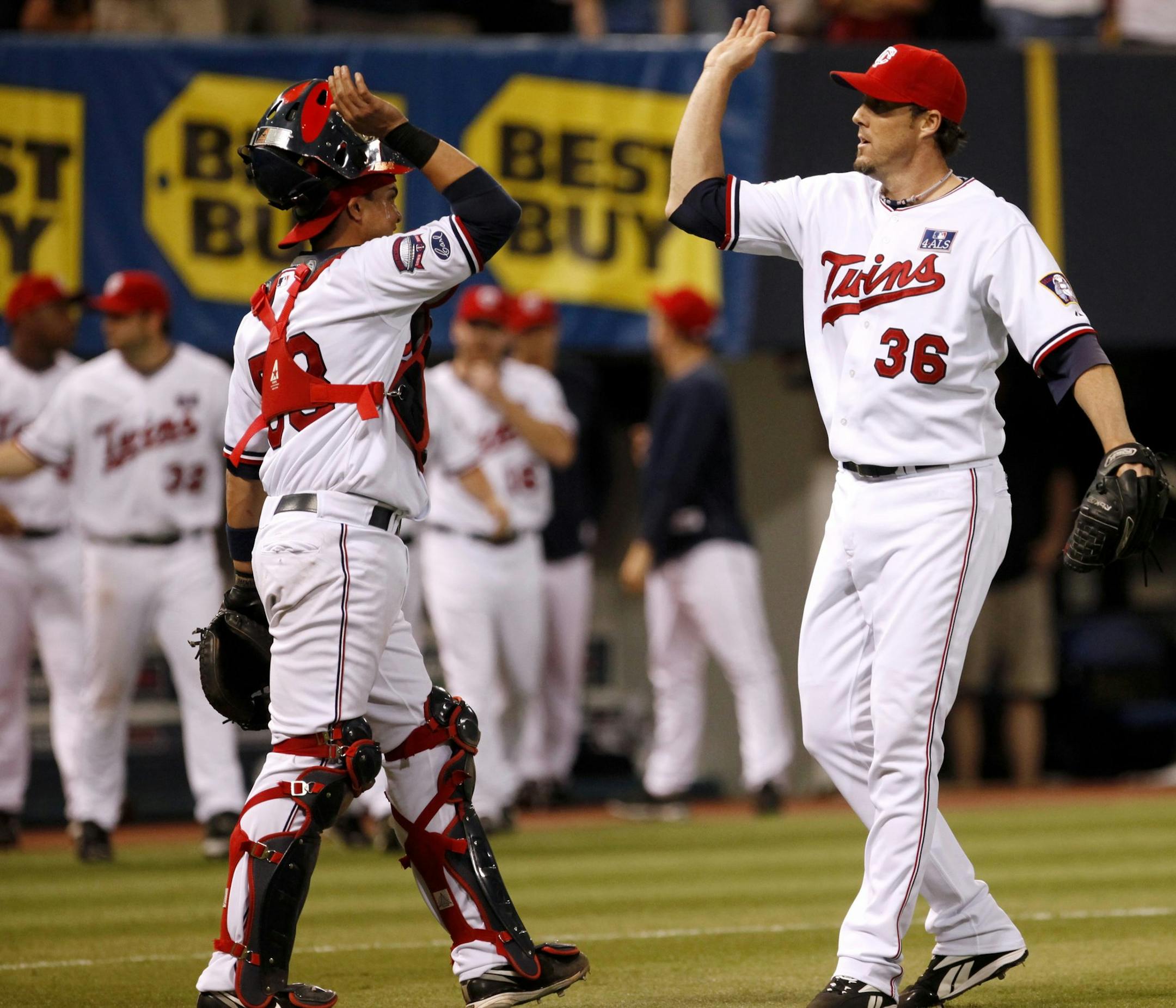 Catcher Jose Morales congratulated closer Joe Nathan after the Twins rallied to beat the Tigers on July 4, 2009.