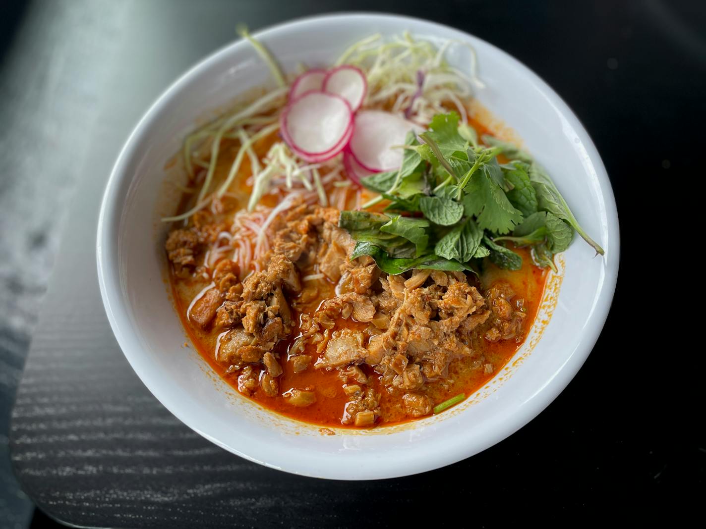 The red curry broth-based khao poon at Yia Vang's Slurp pop-up.