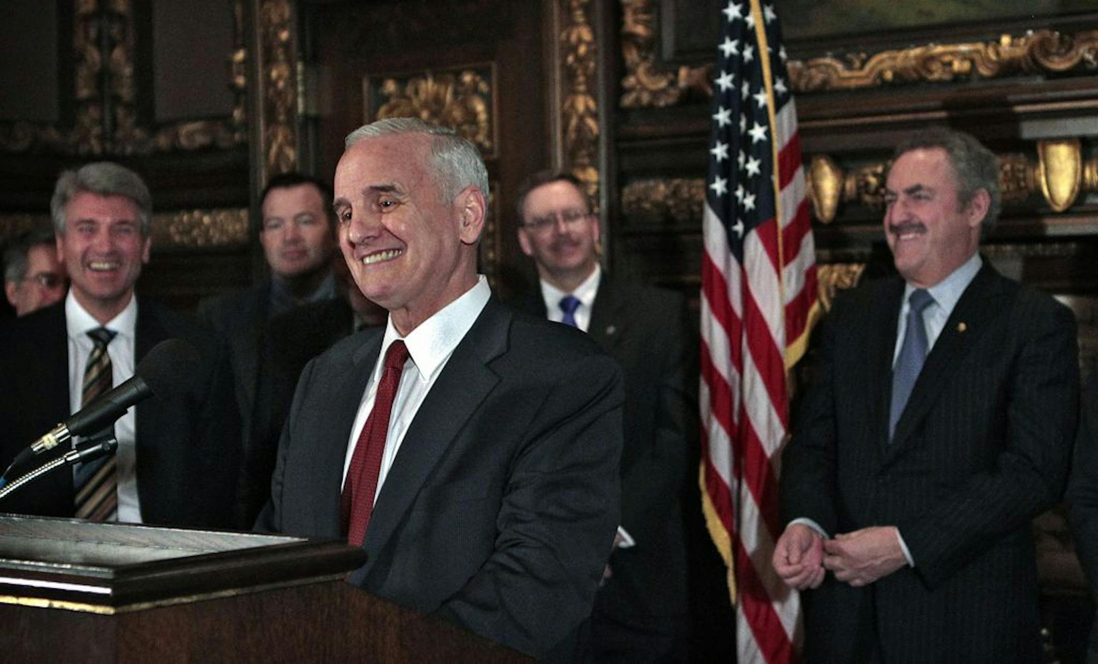 Gov. Mark Dayton, Minneapolis Mayor R.T. Rybak (left), Vikings' owners Zygi Wilf (right) and others held a news conference at the Capitol to announce an agreement to build a new Vikings stadium.