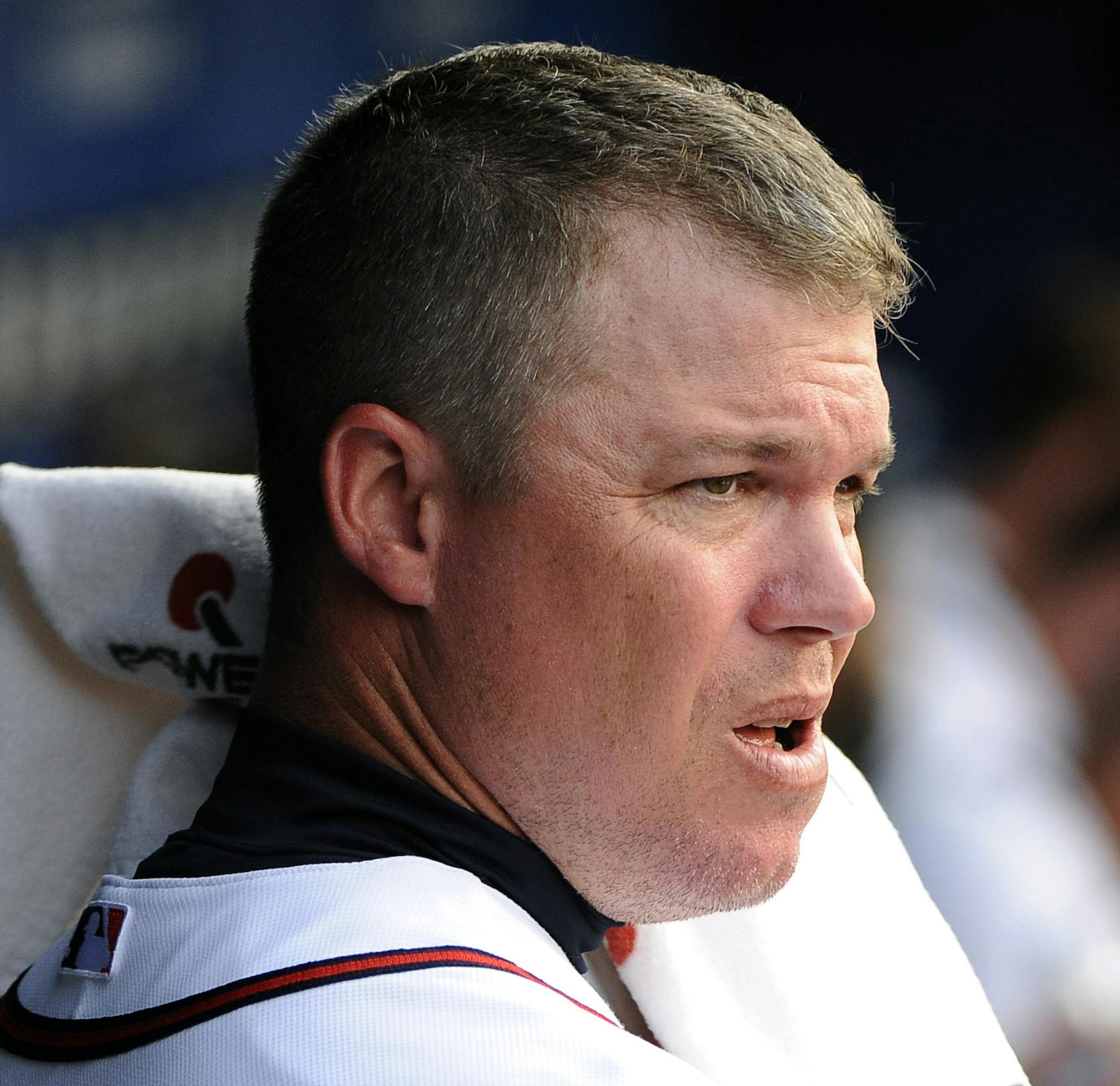 Atlanta Braves' Chipper Jones wipes down with a towel in the second inning of their baseball game against the Chicago Cubs on Monday, July 2, 2012, at Turner Field in Atlanta. (AP Photo/David Tulis) ORG XMIT: GADT104