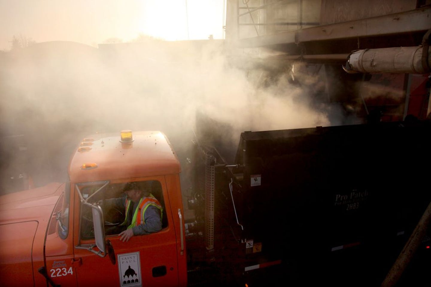 St. Paul's plant churns out 200 tons of hot asphalt mix per hour. That's enough to fill — well, a whole bunch of holes.