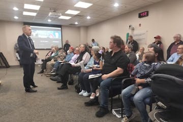 Matthew Bocklund, former chair of the St. Croix County GOP, rallies proponents of pausing refugee resettlement before a March 5 meeting of the St. Cro