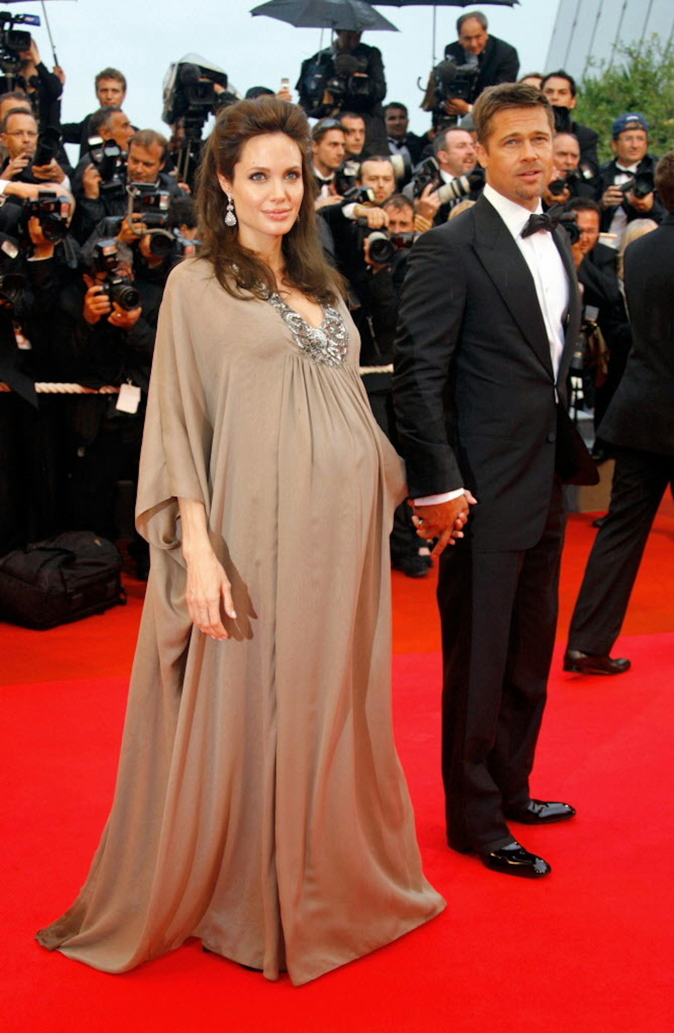 American actors Angelina Jolie and Brad Pitt arrive for the premiere of the film "Changeling" at the 61st International film festival in Cannes, southern France, on Tuesday, May 20, 2008. (AP Photo/Evan Agostini)