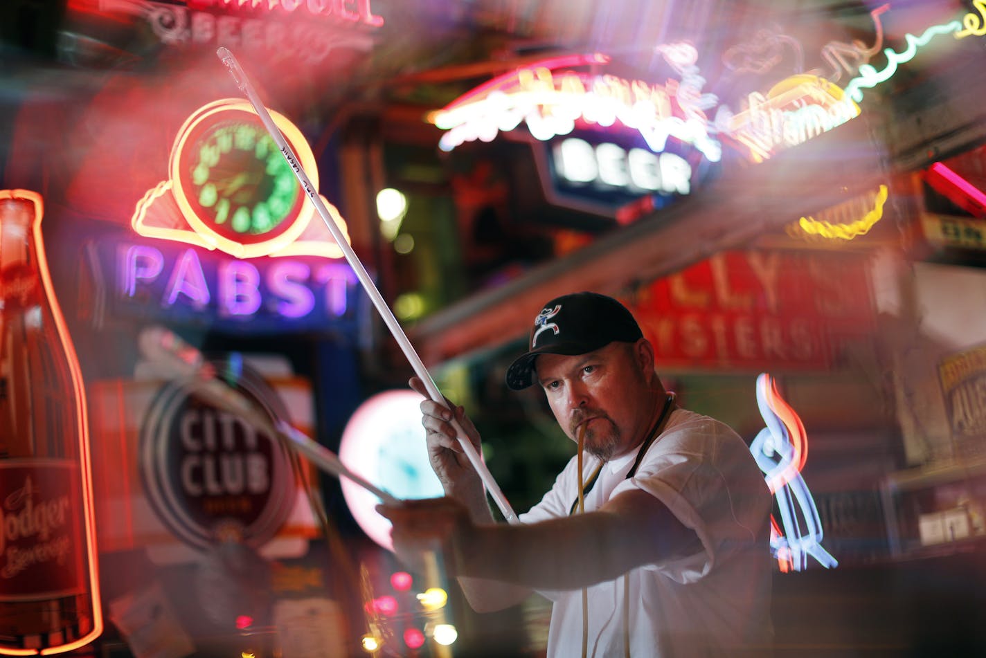 Working in his Minneapolis studio, Skyline Neon, Matt Thompson bent and shaped a glass tube using a gas flame and blowing into the tube so that it retained its cylindrical shape.