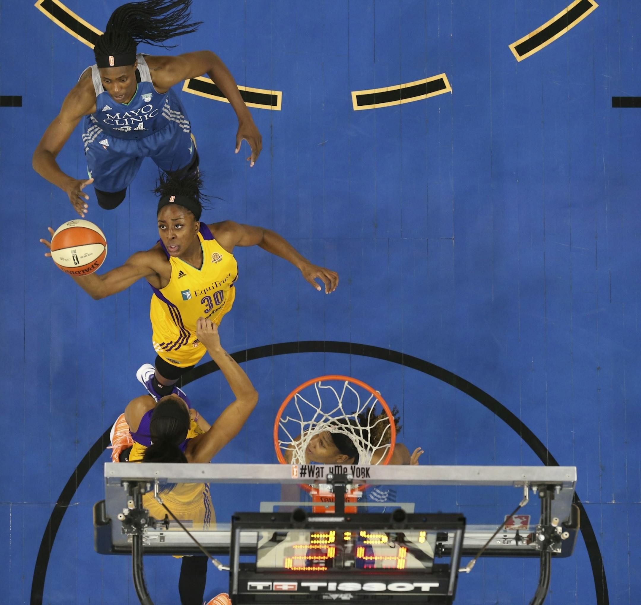 Los Angeles Sparks forward Nneka Ogwumike (30) grabbed an offensive rebound in the second half in front of Minnesota Lynx center Sylvia Fowles (34).