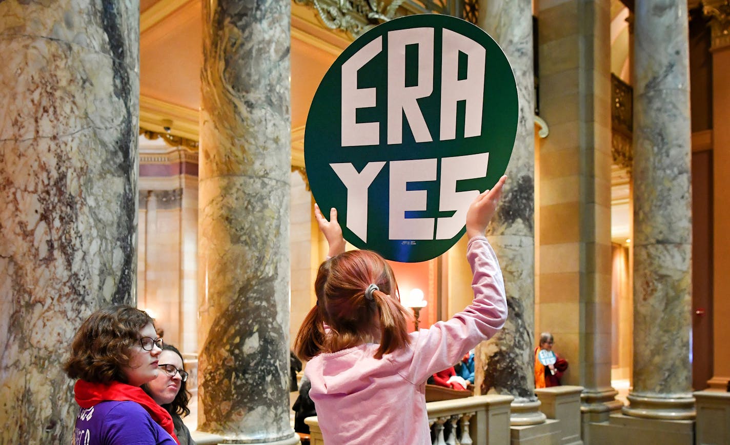 Push to pass the Equal Rights Amendment on International Women's Day at the Capitol. ] GLEN STUBBE &#x2022; glen.stubbe@startribune.com Wednesday, March 8, 2017 Push to pass the Equal Rights Amendment on International Women's Day at the Capitol. Following a press conference calling for the passage of the long-sought Equal Rights Amendment, many women gathered in support are fanning out across the State Capitol. EDS, don't have this girls name. ORG XMIT: MIN1703081343510145