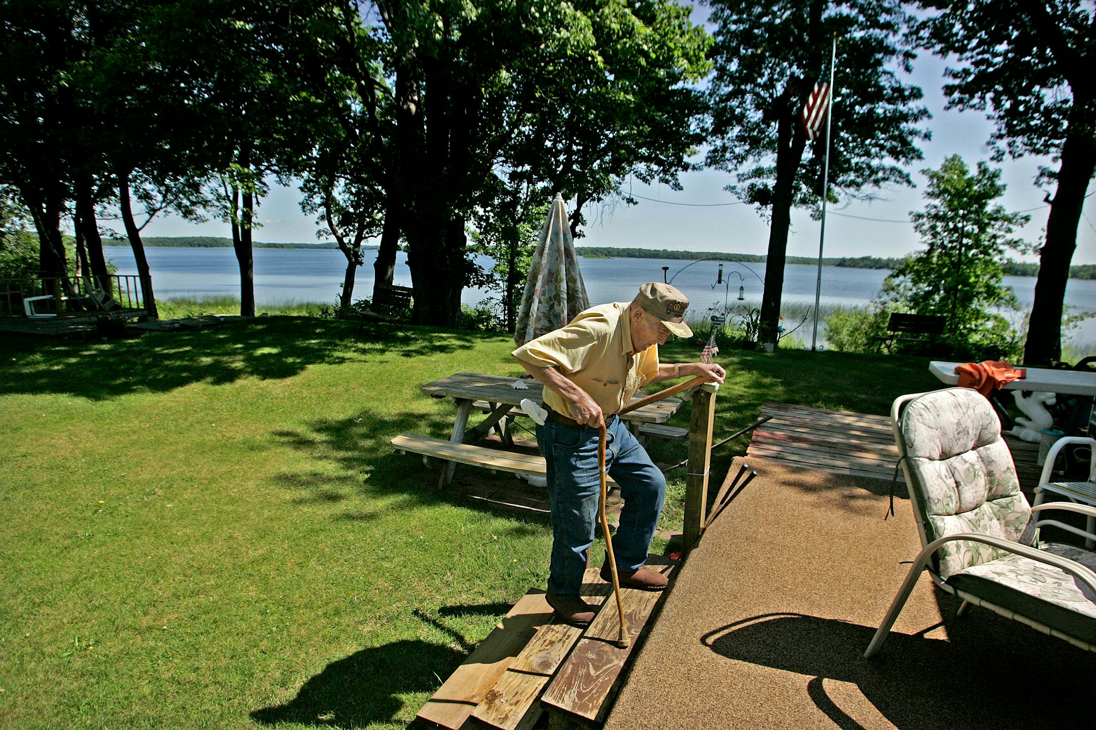 Ray Ellis, 85, made his way up the stairs to his camping trailer at the Disabled Veterans Rest Camp in northern Washington County. Ellis, a six-time purple heart recipient, is one of three World War II veterans who vacation regularly at the camp, which gives veterans a way to recuperate from the stress of war.