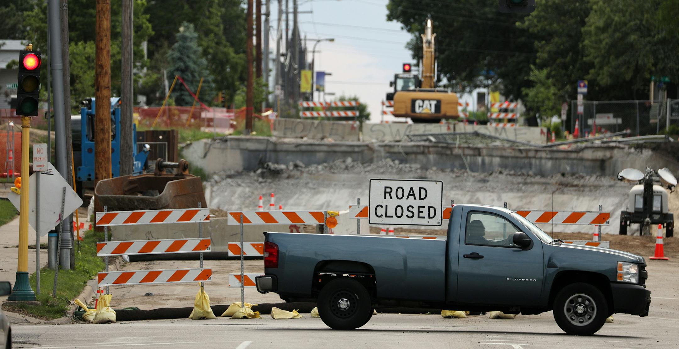Construction continued along 5th Avenue South during the evening rush hour Friday. ] ANTHONY SOUFFLE ï anthony.souffle@startribune.com Commuters navigated Portland Avenue southbound during the evening rush hour Friday, June 15, 2018 in Minneapolis. The closed ramps on 35W are causing a lot more traffic to be routed through near south Minneapolis. Portland Avenue southbound is a parking lot at afternoon rush hour and impatient drivers dart down side streets to escape to their homes.