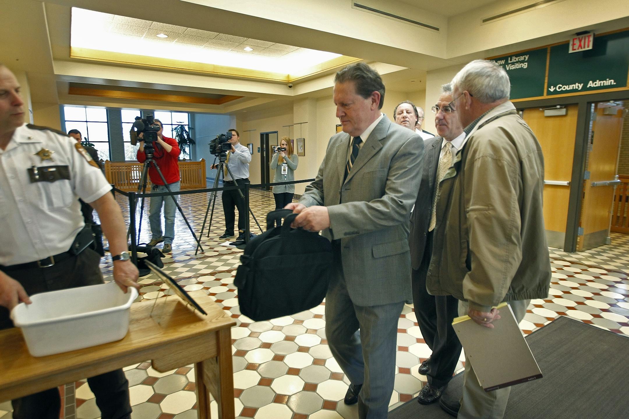 Defendant Byron Smith made his way through security at the Morris County Courthouse, Monday, April 21, 2014 in Little Fall, Minn.