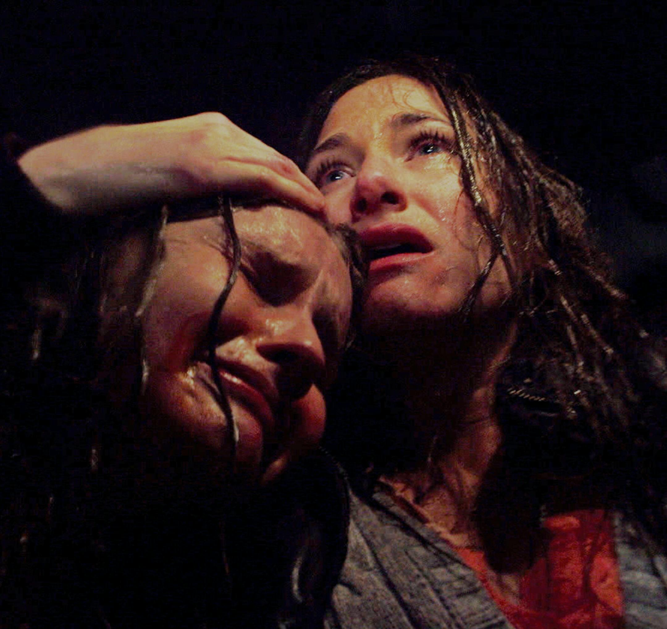 In this image released by Universal Pictures, Olivia DeJonge, left, and Kathryn Hahn appear in a scene from "The Visit." (Universal Pictures via AP)