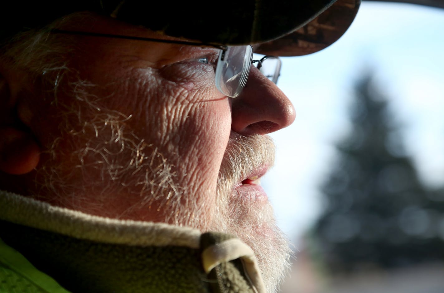 Rick Johnson in his Chevy pickup truck headed out to pick up a road kill deer near his house Thursday, March 2, 2017, in Nowthen, MN. Johnson, through his Deer and Beaver Inc business, has been making a living out of removing deer carcasses on nearby county and town roadways for the last 25 years but is involved in a lawsuit with Anoka County for breach of contract and a judge recently ruled the county must pay Johnson $425,000.