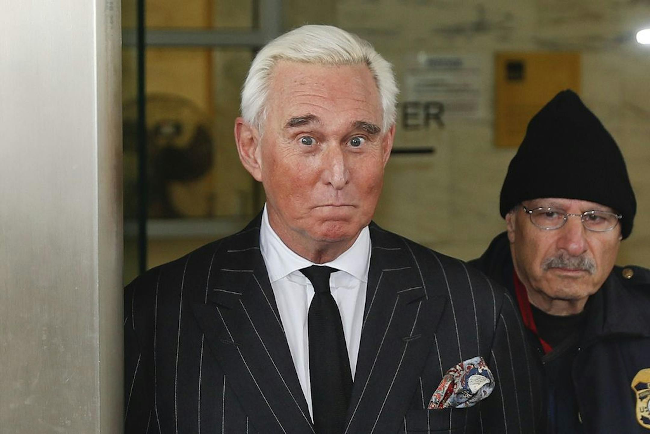 FILE - In this Feb. 1, 2019 file photo, former campaign adviser for President Donald Trump, Roger Stone, leaves federal court in Washington.