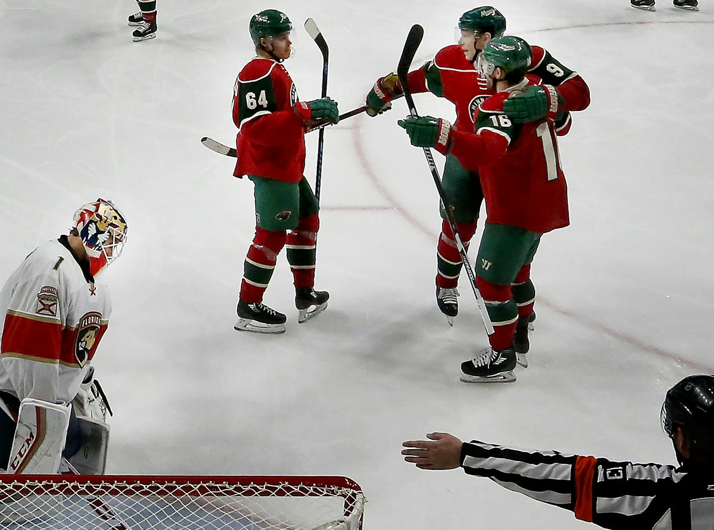 Mikko Koivu (9) celebrated with Jason Zucker (16) and Mikael Granlund (64) after scoring a goal in the third period. ] CARLOS GONZALEZ cgonzalez@startribune.com - December 13, 2016, St. Paul, Minnesota, NHL Hockey, Xcel Energy Center, Minnesota Wild vs. Florida Panthers