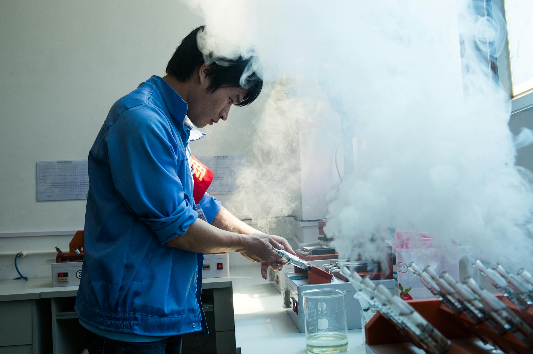 A worker tests assembled e-cigarettes at Innokin Technology in Shenzhen, China, March 24, 2014. Almost all the world’s e-cigarettes are made without oversight, and experts say counterfeiting, or sloppy manufacturing could account for some of the hazards seen in the devices. (Sim Chi Yin/The New York Times)
