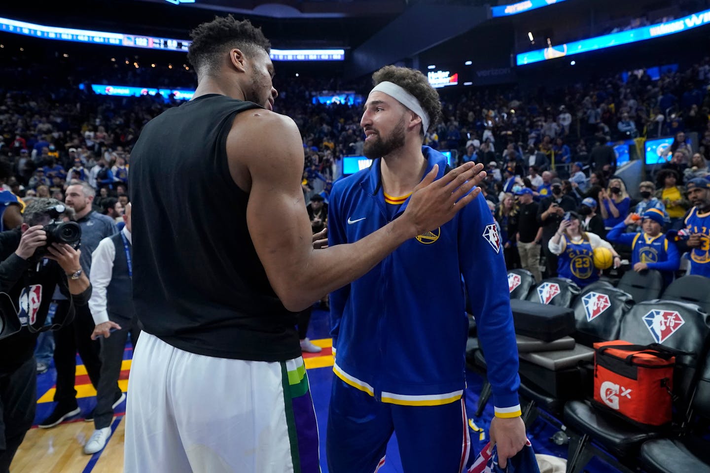 Milwaukee Bucks forward Giannis Antetokounmpo, left, greets Golden State Warriors guard Klay Thompson after an NBA basketball game in San Francisco, Saturday, March 12, 2022. (AP Photo/Jeff Chiu)