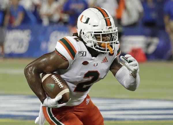 Miami wide receiver K.J. Osborn runs against Florida after a reception during the second half of an NCAA college football game, Saturday, Aug. 24, 201