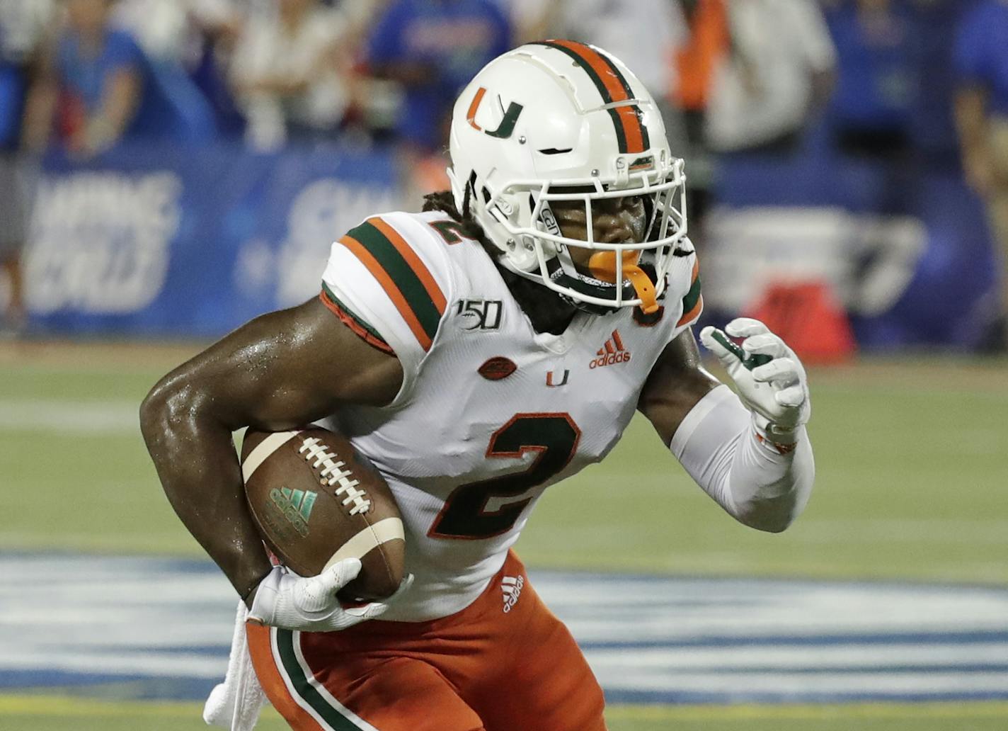 Miami wide receiver K.J. Osborn runs against Florida after a reception during the second half of an NCAA college football game, Saturday, Aug. 24, 2019, in Orlando, Fla. (AP Photo/John Raoux) ORG XMIT: OTK