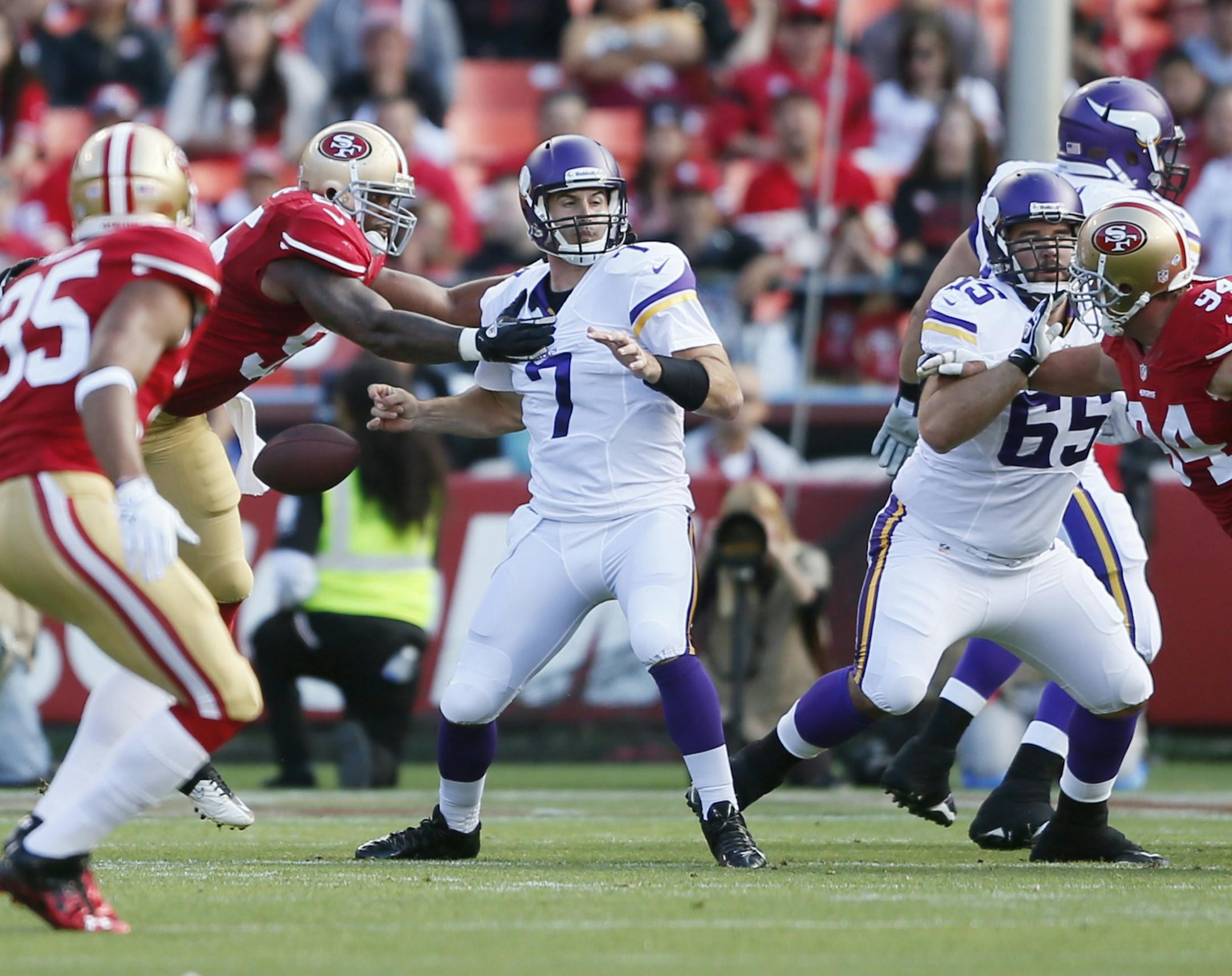 Ahmad Brooks of the 49ers hits the ball causing Christian Ponder to fumble in the first quarter during the Minnesota Vikings third preseason game against the San Francisco 49ers at Candlestick Park, Sunday Aug 25 ,2013 in San Francisco , CA.