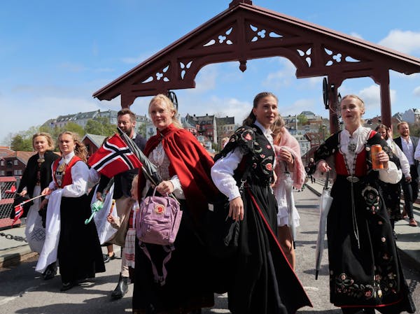 Festive Norwegians celebrated the Syttende Mai (17th of May) holiday on the Old Town Bridge in Trondheim.